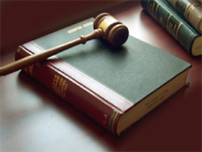 Image of a gavel on top of law books.